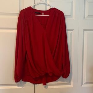 Beautiful red crepe feel shirt. High in the front and lower in the back